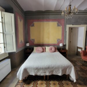 Bed in the hotel with pink pillows