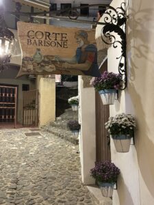 The restaurant sign in the small street